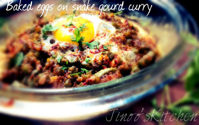 Baked eggs on spicy snake gourd curry