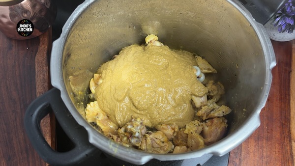 Ground coconut masala added to chicken for Kongu style chicken curry