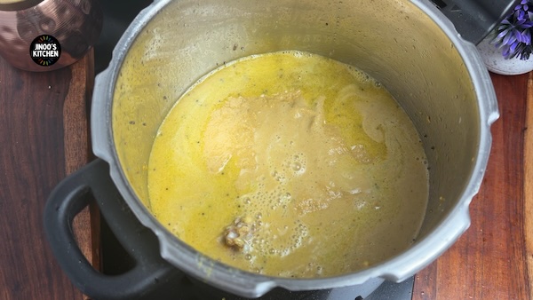 Water added to chicken kuzhambu for thin gravy