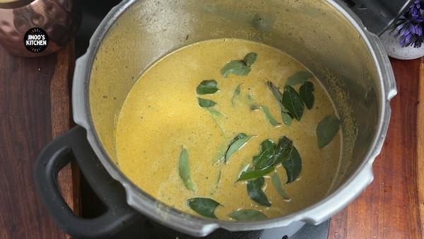 curry leaves added to chicken kuzhambu for thin gravy