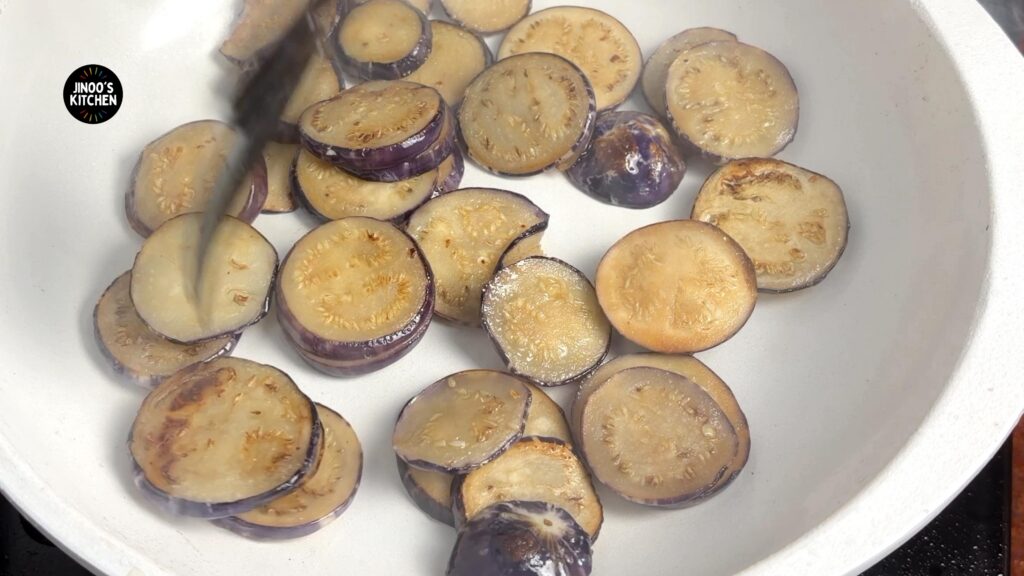 cooking the brinjal until soft