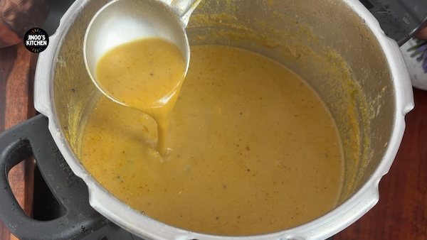 Kongu style chicken thanni kulambu cooked in a pressure cooker