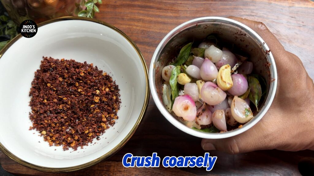 take the roasted small onions in the mixie jar